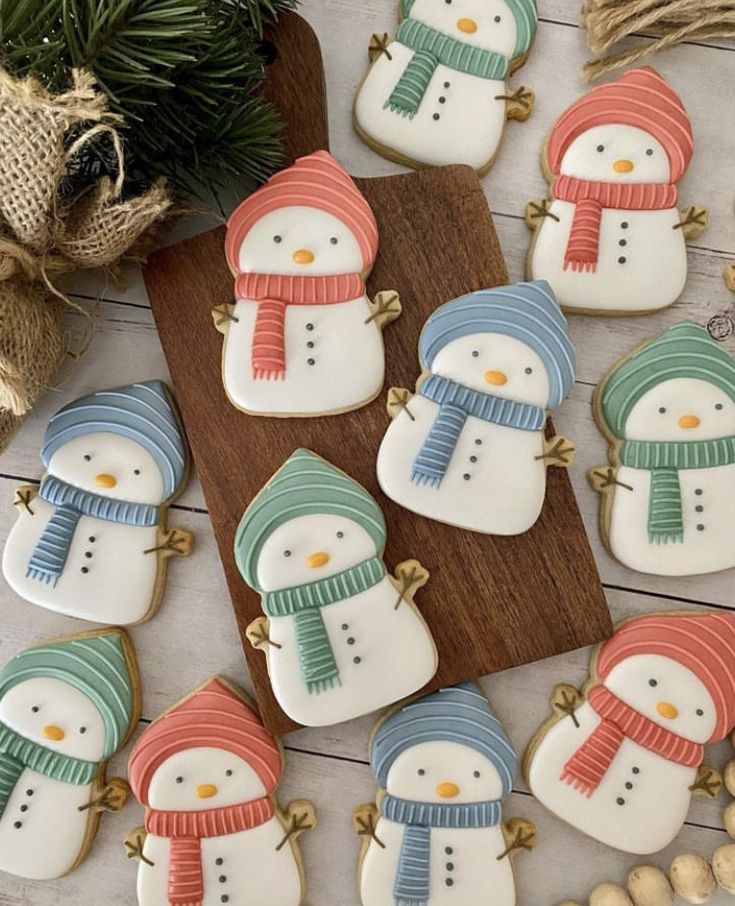 Festive Snowman Cookies with Whimsical Designs for Holiday Celebrations