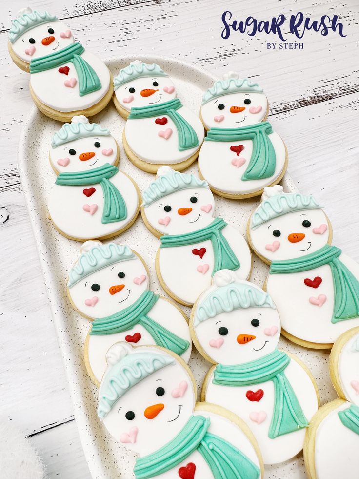 Charming Pastel Snowman Cookies: Irresistible Winter Treats Decorated with Cheerful Details.