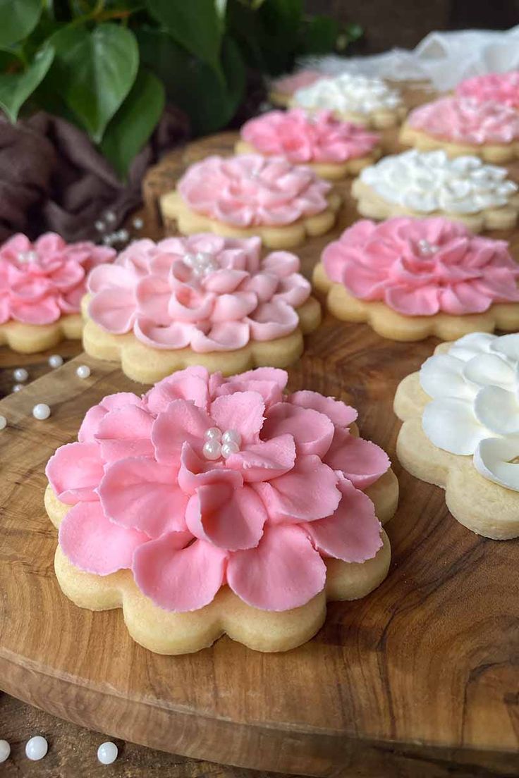 Elegant Floral-Themed Cookies Decorated with Intricate Icing and Edible Pearls.