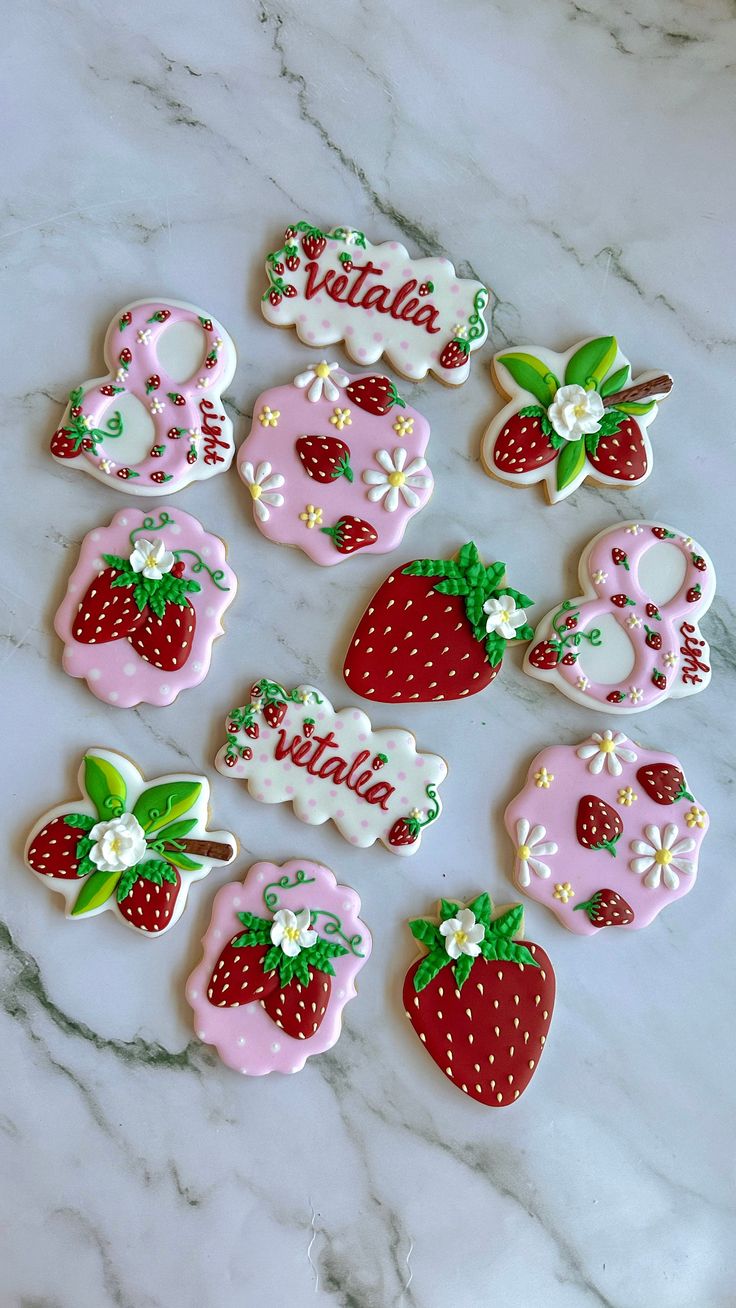 Whimsical Seasonal Cookie Designs Featuring Vibrant Strawberries and Delicate Flowers