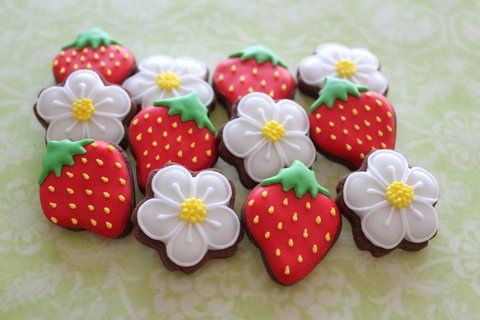 Vibrant Springtime Cookies Adorned with Strawberries and Floral Icing Accents.