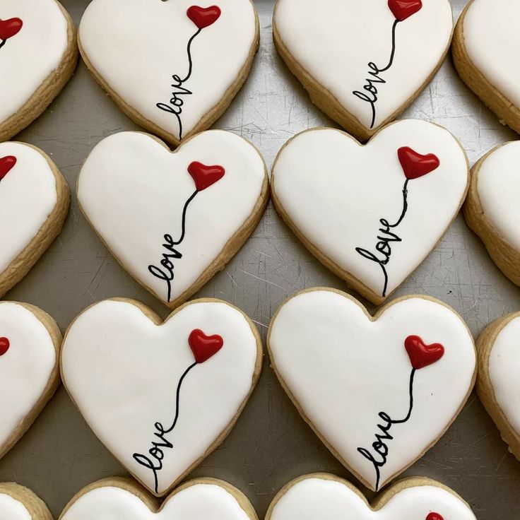 Elegant Heart-Shaped Cookies with Glossy Icing and Romantic Accents