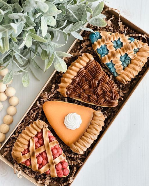 Intricately Designed Pie-Shaped Cookies with Festive Icing