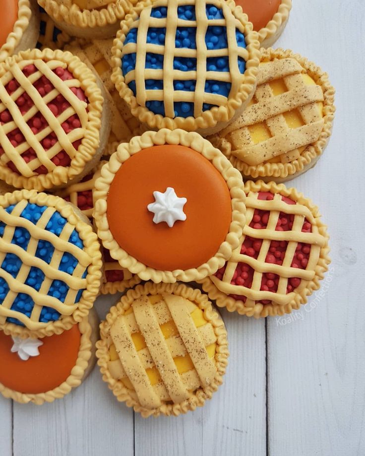 Colorful Pie-Inspired Cookies with Lattice Patterns and Whipped Cream Topping.