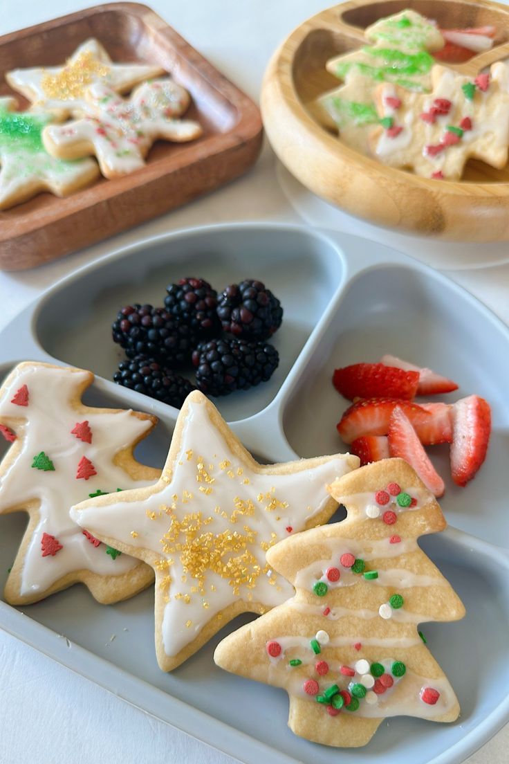 Elegant Christmas Cookies with Festive Sprinkles and Fresh Berries.