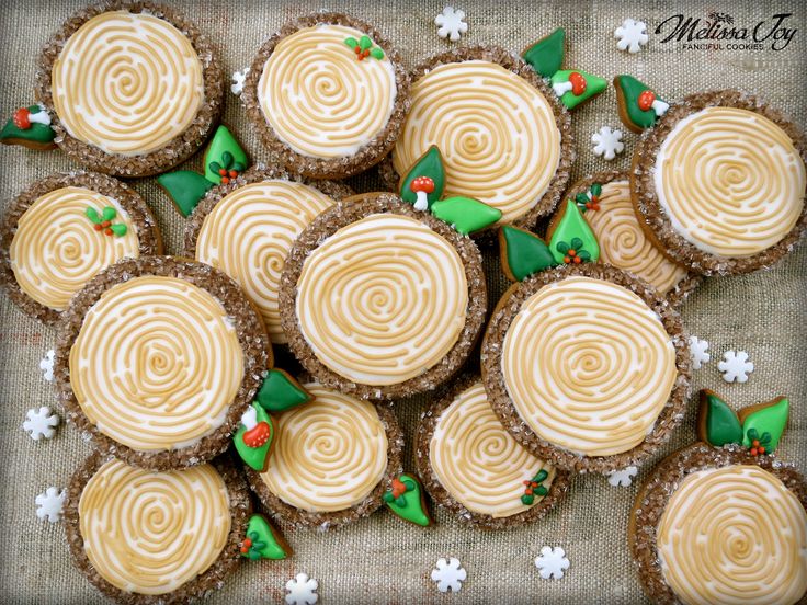 Whimsical Colorful Cookies Adorned with Spiral Icing and Leaf Accents.