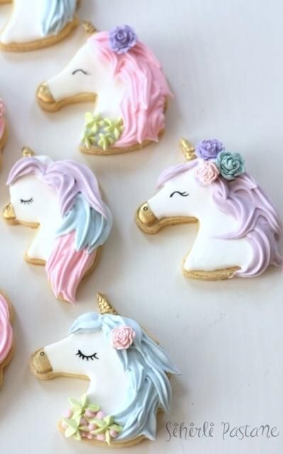 Whimsical Colorful Unicorn Cookies with Intricate Icing and Floral Accents