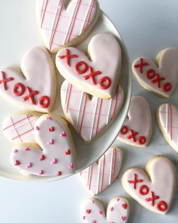 Whimsical Heart-Shaped Cookies: Pastel Icing and Playful Designs for Romantic Celebrations.