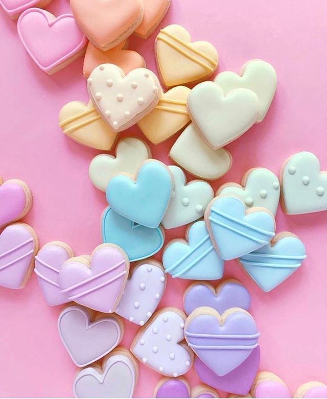 Cheerful Heart-Shaped Cookies Inspire Creative Nail Art Ideas Through Playful Designs and Pastel Colors.