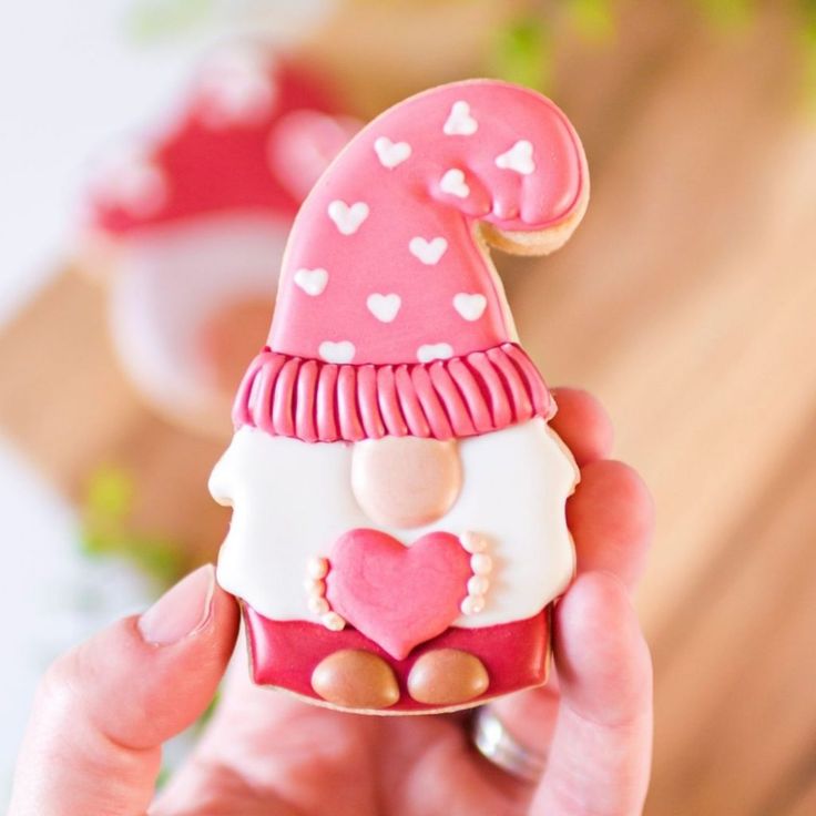 Charming Whimsical Gnome Cookie Design with Heart-Adorned Hat for Festive Celebrations.