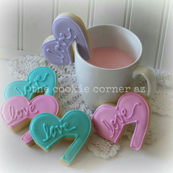 Charming Heart-Shaped Cookies in Soft Pastels Surrounding a Mug