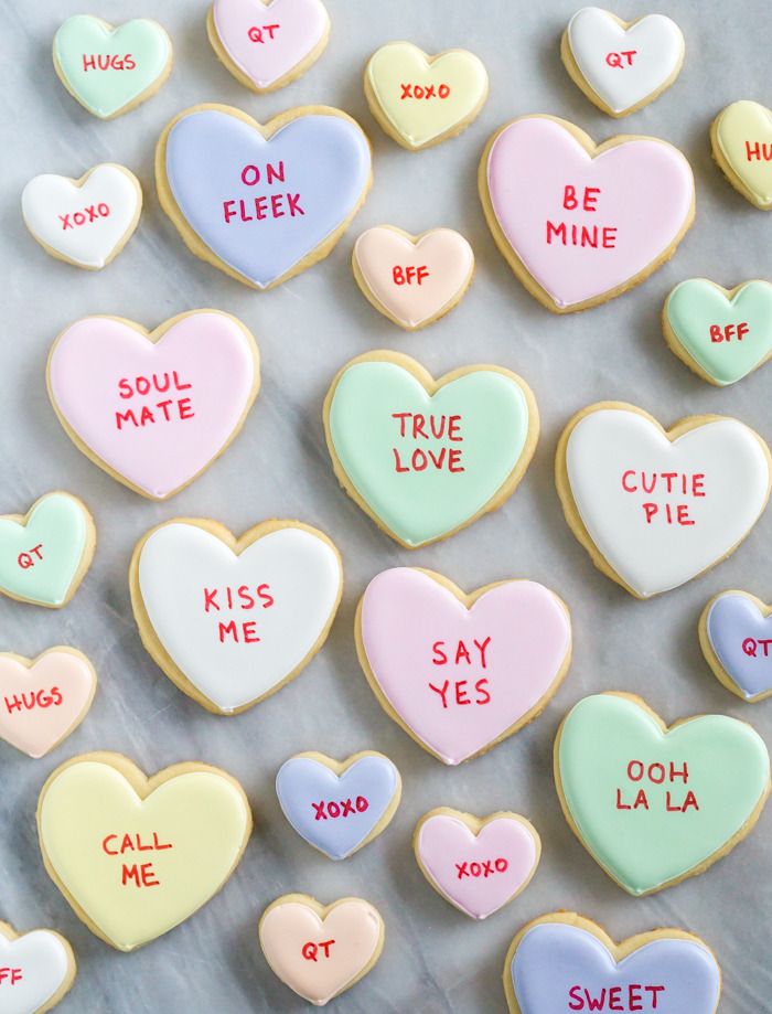 Whimsical Heart-Shaped Cookies in Pastel Colors for Celebrations and Themed Parties.