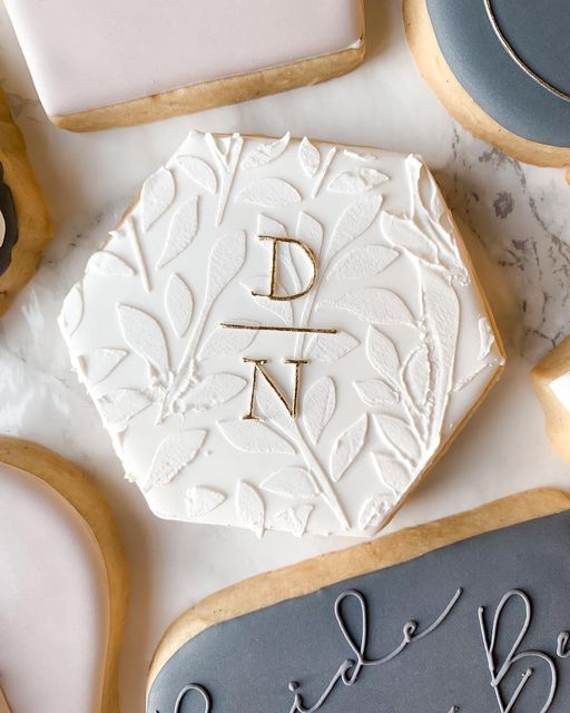 Sophisticated Hexagonal Sugar Cookie Design with Intricate Leaf Patterns and Elegant Embossed Details.