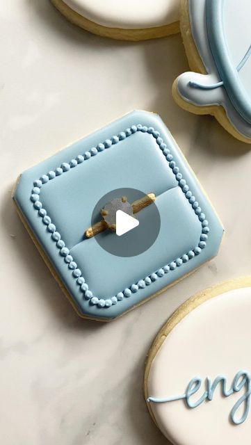 Elegant Decorative Cookies with Soft Blue Icing for Special Occasions.