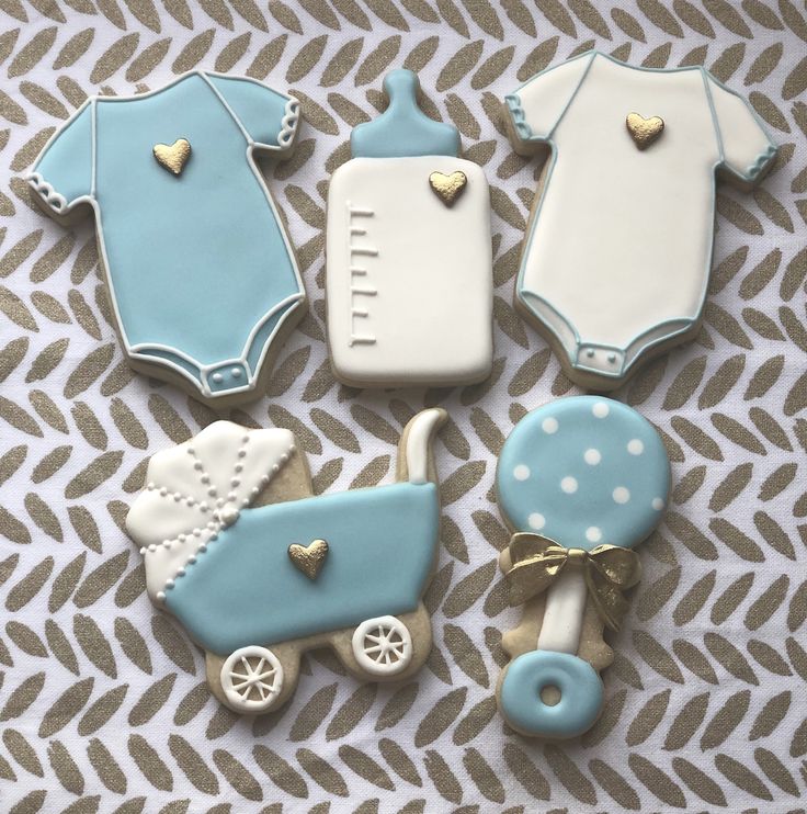 Elegant Baby-Themed Decorative Cookies in Soft Blue and White with Golden Hearts.