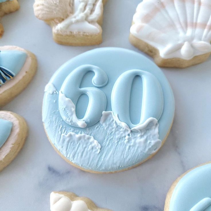 Serene Ocean-Themed Decorative Cookies: Festive Yet Tranquil Milestone Celebration.