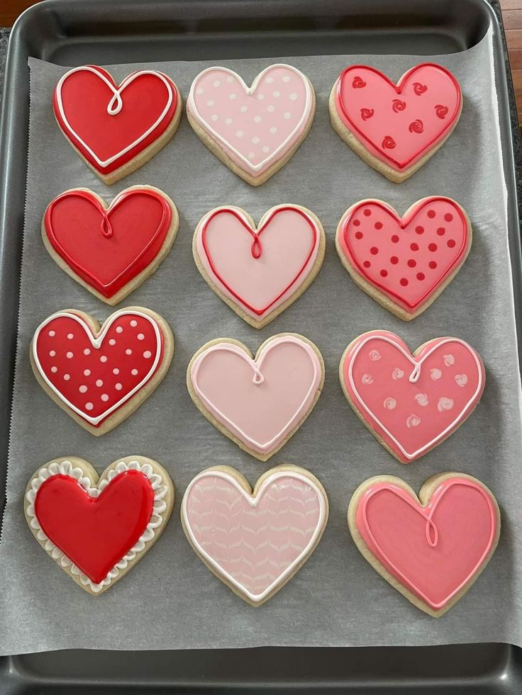 Whimsical Heart-Shaped Cookies in Vibrant Reds and Pinks for Celebrations and Romance.