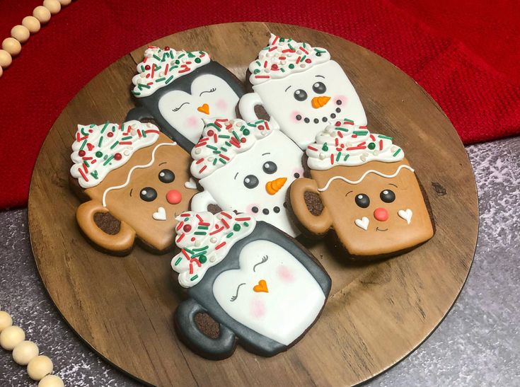 Adorable Winter Character Cookies and Cheerful Mugs for a Cozy Holiday Spirit.