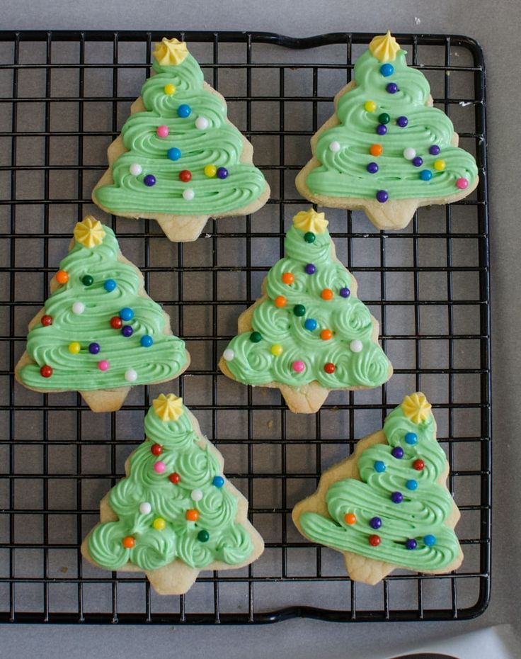 Cheerful Christmas Tree Cookies with Vibrant Frosting and Star Toppers.