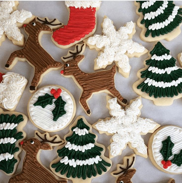 Cheerful Holiday Cookie Designs: Reindeer, Christmas Trees, Snowflakes, and Santa Themes with Vibrant Icing.