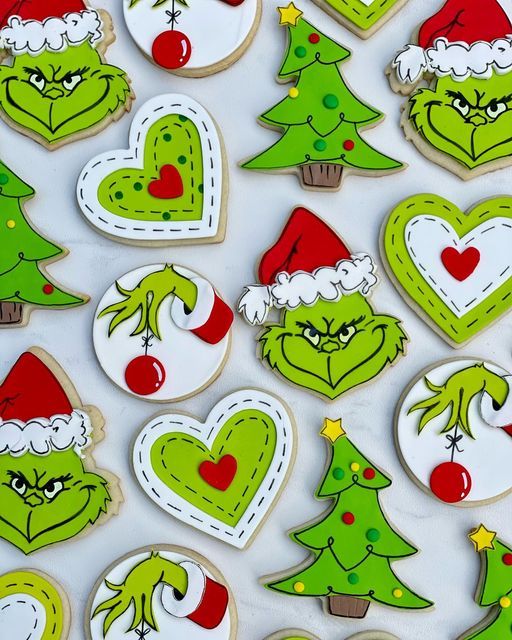 Whimsical Festive Cookie Designs: Grinch, Christmas Trees, and Playful Hearts.