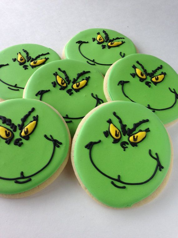 Festive Whimsical Cookies: Vibrant Green Circles with Mischievous Designs