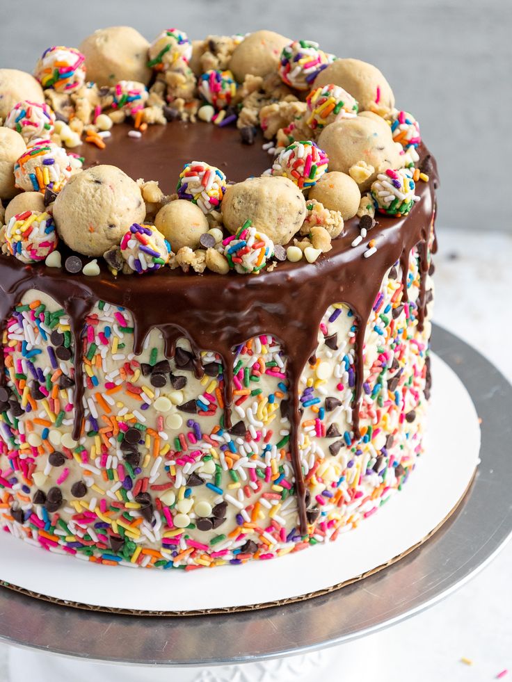 Vibrant Cake Design with Glossy Chocolate Ganache and Colorful Toppings.