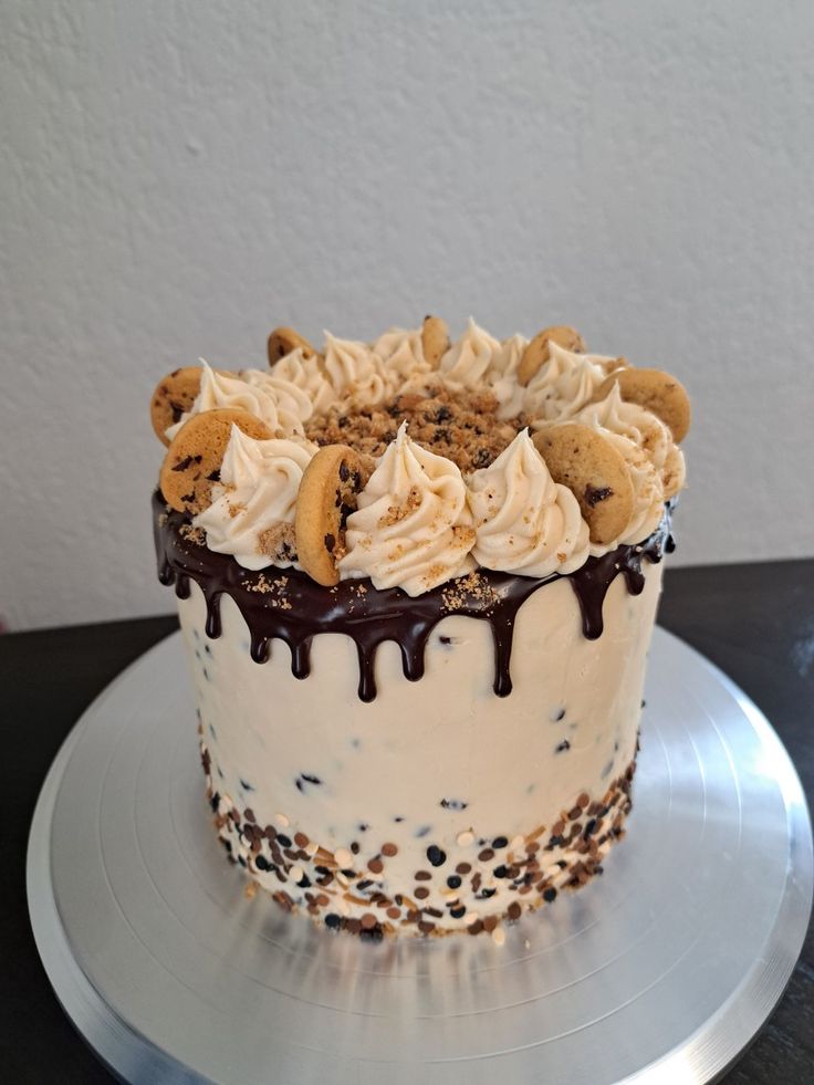 Indulgent Cake with Creamy Frosting, Cookie Crumbles, and Chocolate Drizzle.