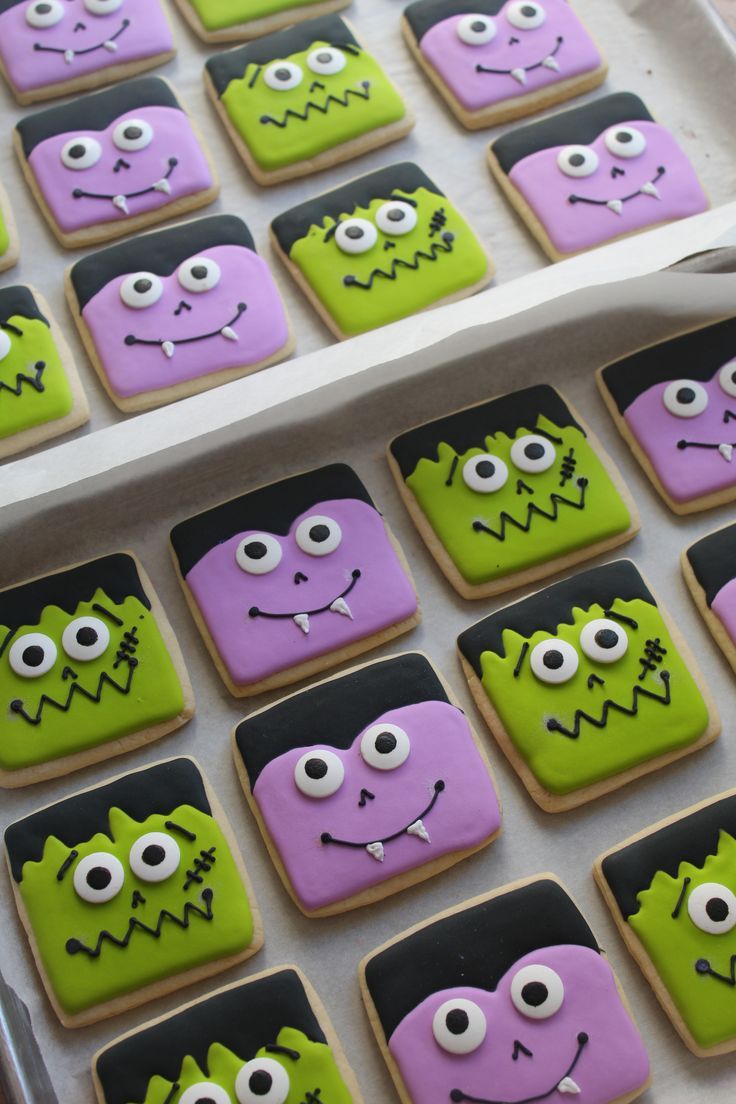 Whimsical Halloween Cookies: Colorful Monsters with Fun Expressions for Festive Celebrations.