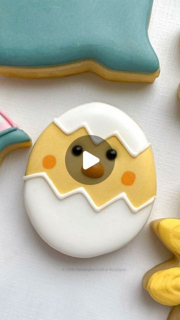 Whimsical Egg and Chick Cookie Design in Soft Pastels for Seasonal Celebrations.