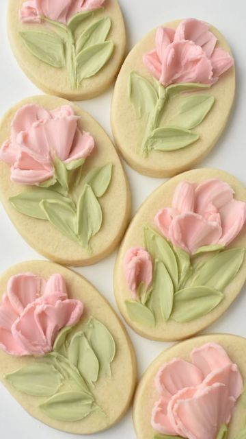 Elegant Floral Cookie Designs with Pink Tulips and Green Leaves Capturing Springtime Aesthetics.