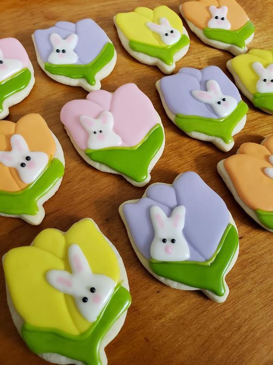 Charming Colorful Floral Cookies with Playful Bunny Designs for Spring Celebrations.