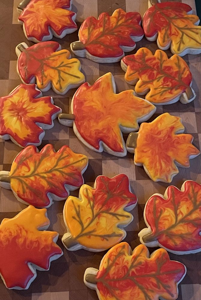 Autumnal Delight: Vibrant Leaf-Shaped Cookies with Intricate Marbling.