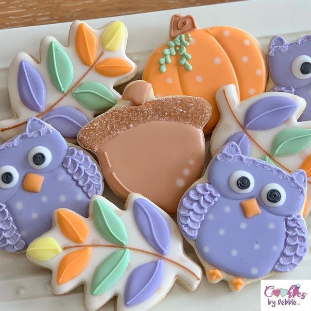 Charming Whimsical Cookie Designs with Cute Owls and Colorful Autumn Leaves for Festive Celebrations.