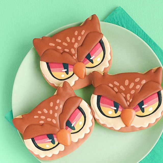 Whimsical Owl-Shaped Cookies with Intricate Icing Designs for Themed Parties.