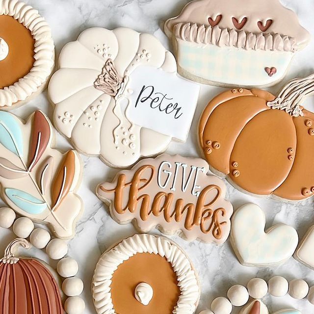 Autumn-Themed Decorative Cookies in Cozy Pastels and Intricate Designs.