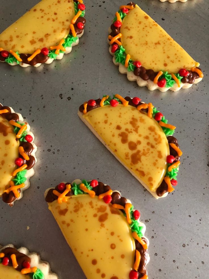 Whimsical Taco-Shaped Cookies with Vibrant Icing Decorations.