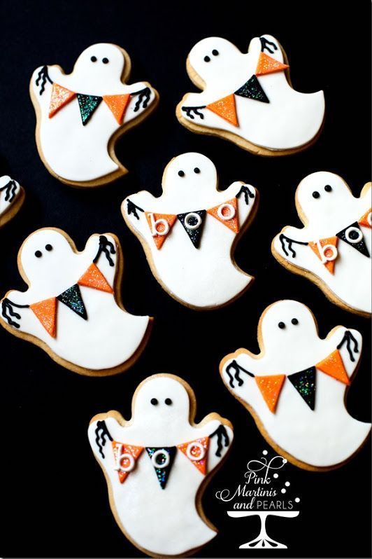 Festive Playful Ghost Cookies for Halloween Celebrations.