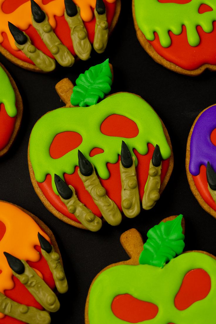 Vibrant Halloween Cookies: Spooky Pumpkin Designs with Creepy Icing Decor.