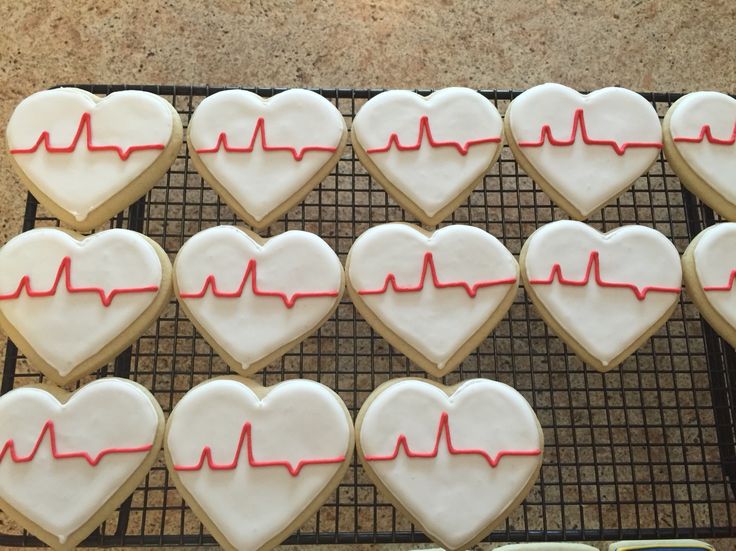 Charming Heart-Shaped Cookies with Vibrant Heartbeat Icing for Love-Filled Celebrations.