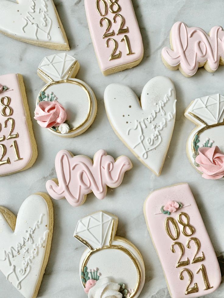 Romantic-Themed Decorative Cookies: Elegant Hearts and Diamond Rings Adorned with Pastels and Gold Accents for Weddings and Engagements