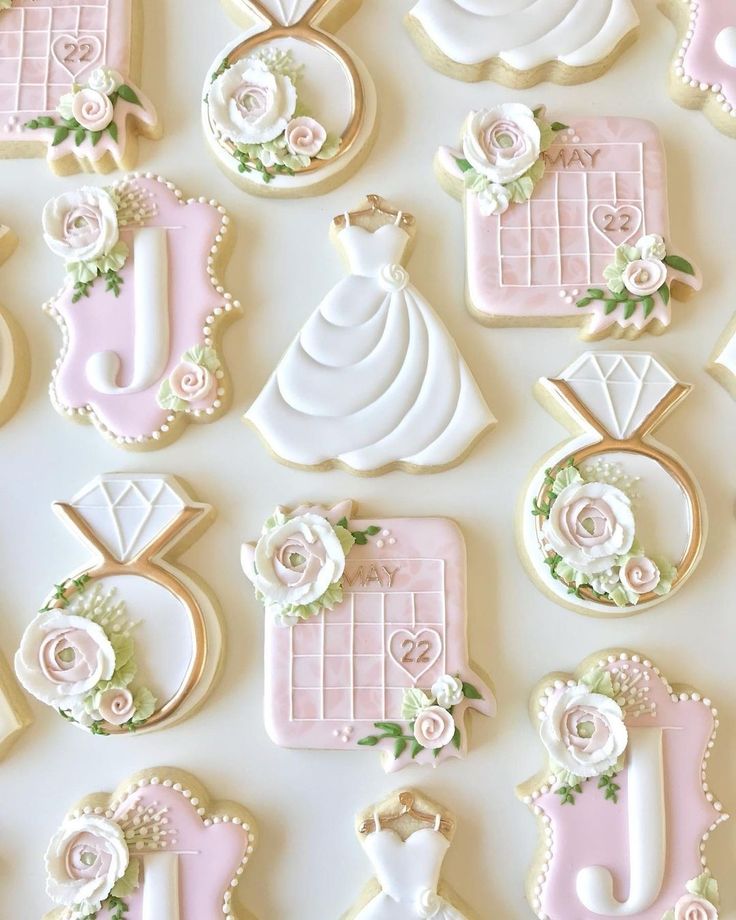 Whimsical Wedding-Themed Cookie Designs with Delicate Motifs and Floral Accents.