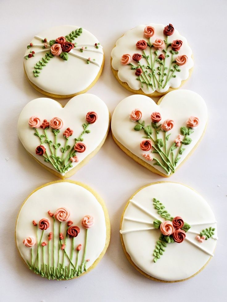 Charming Floral-Inspired Cookies with Intricate Icing Designs and Unique Shapes