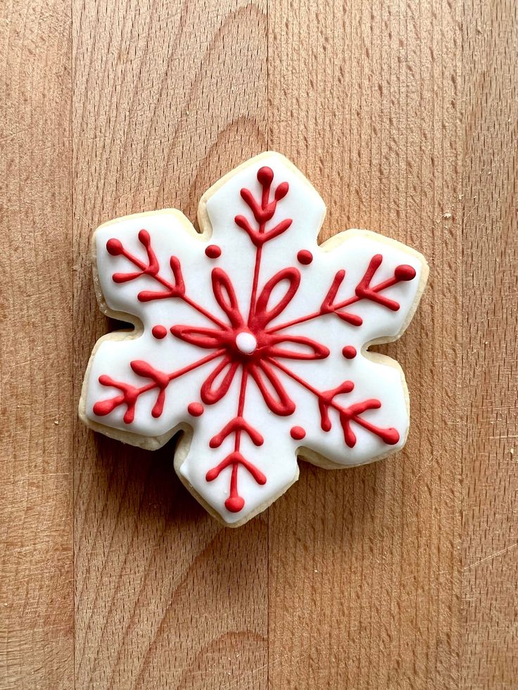 Festive Red and White Snowflake Nail Art Inspiration for Winter Celebrations.