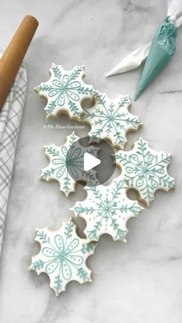 Festive Teal and White Snowflake Cookies: A Winter Wonderland Treat for Holiday Celebrations.