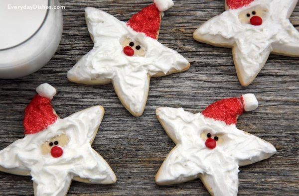 Whimsical Santa Claus Star Cookies with Festive Red Accents and Fluffy Frosting