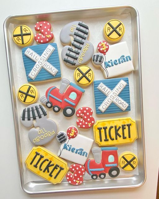 Vibrant Train-Themed Cookies Featuring Whimsical Shapes and Festive Decorations.