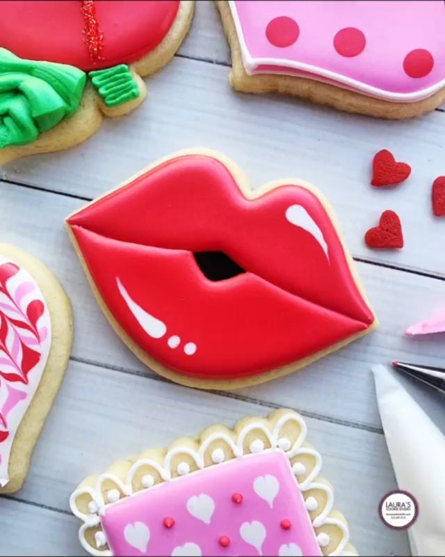 Playful Themed Cookies: Vivid Red Kiss-Shaped Delight in a Festive Arrangement.