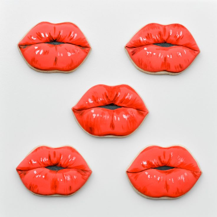 Bold and Playful Lip-Shaped Cookies with Glossy Red Finish: A Stylish Dessert Choice for Any Event.