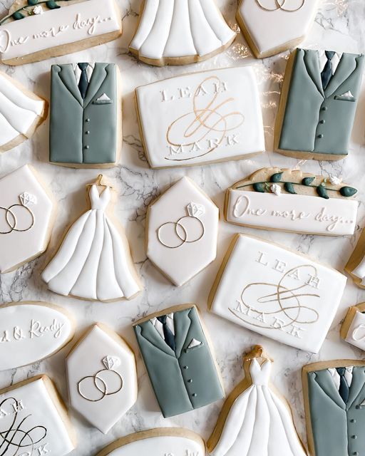 Intricate Wedding-Themed Cookies with Elegant Designs and Personalized Touches.